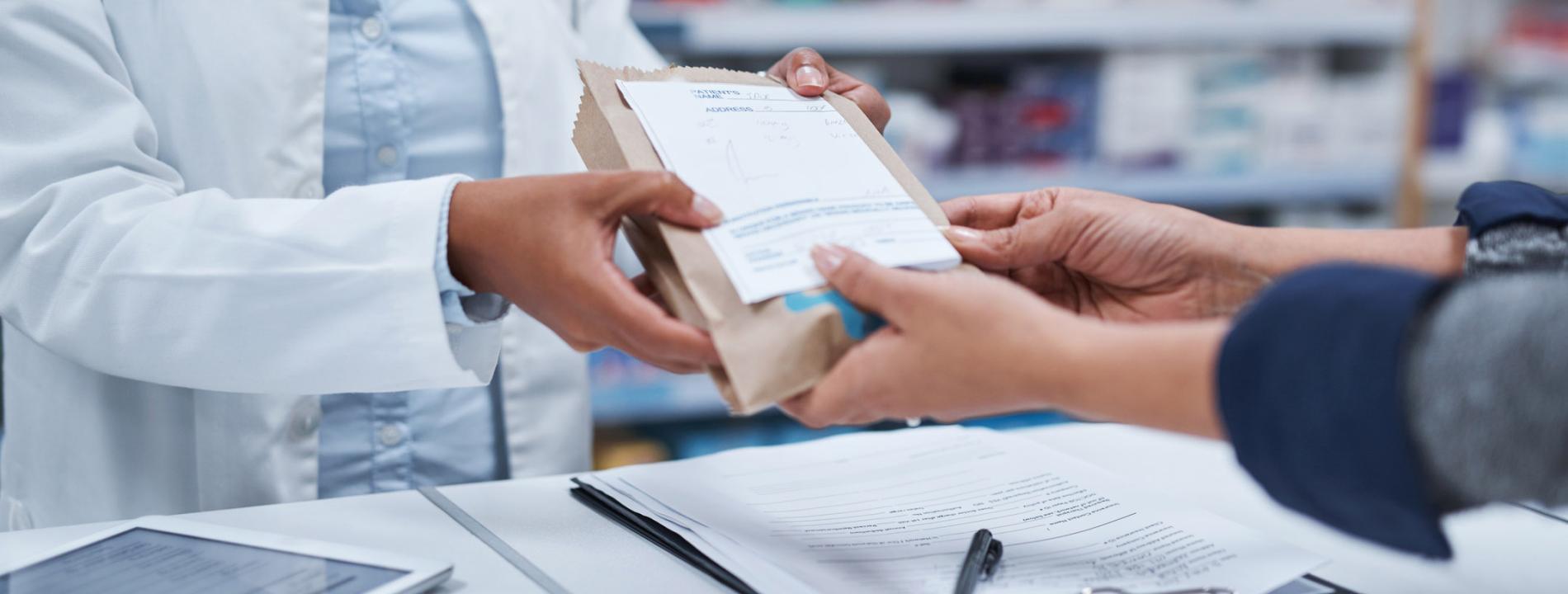 Photo of pharmacist assisting customer